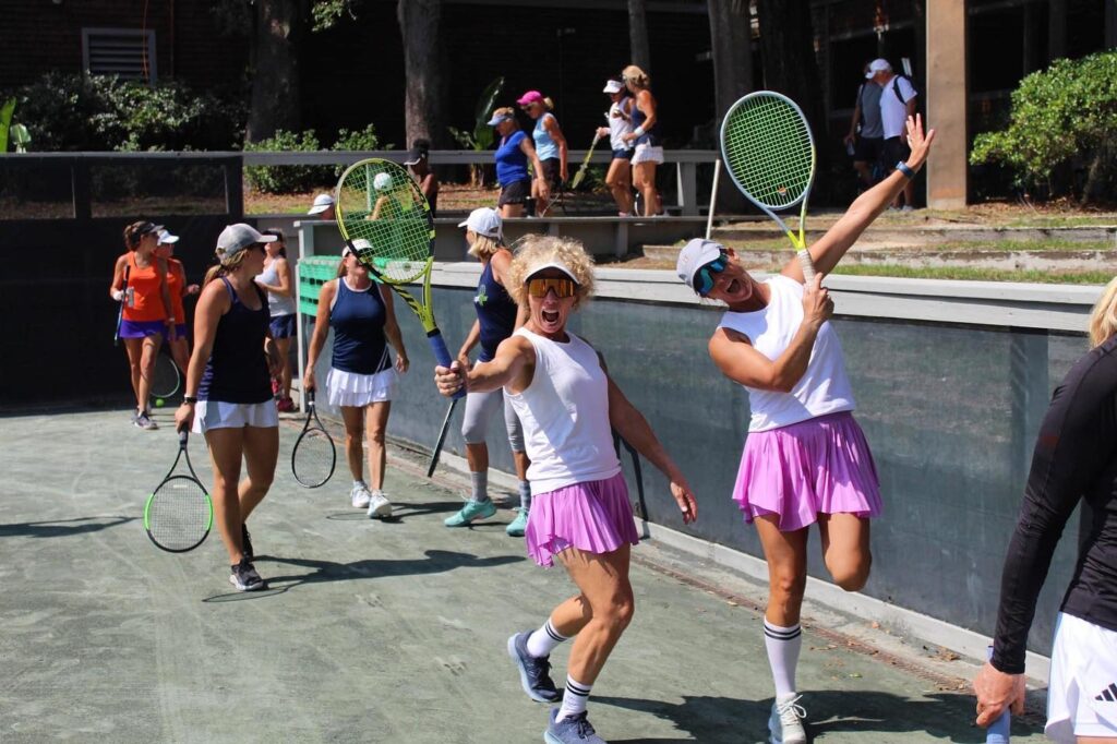 Excited tennis women playing in tennis tournament. 